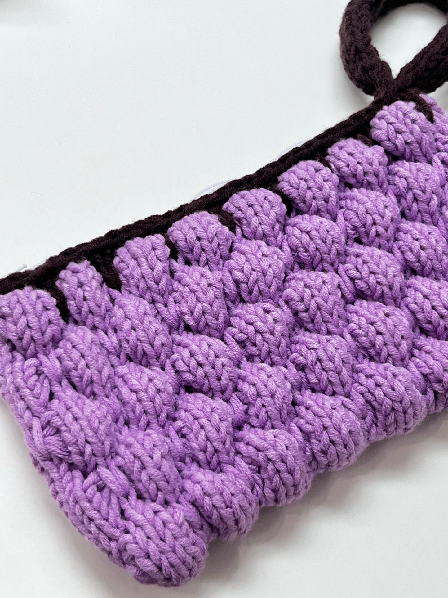 Mom’s purple wrist bag