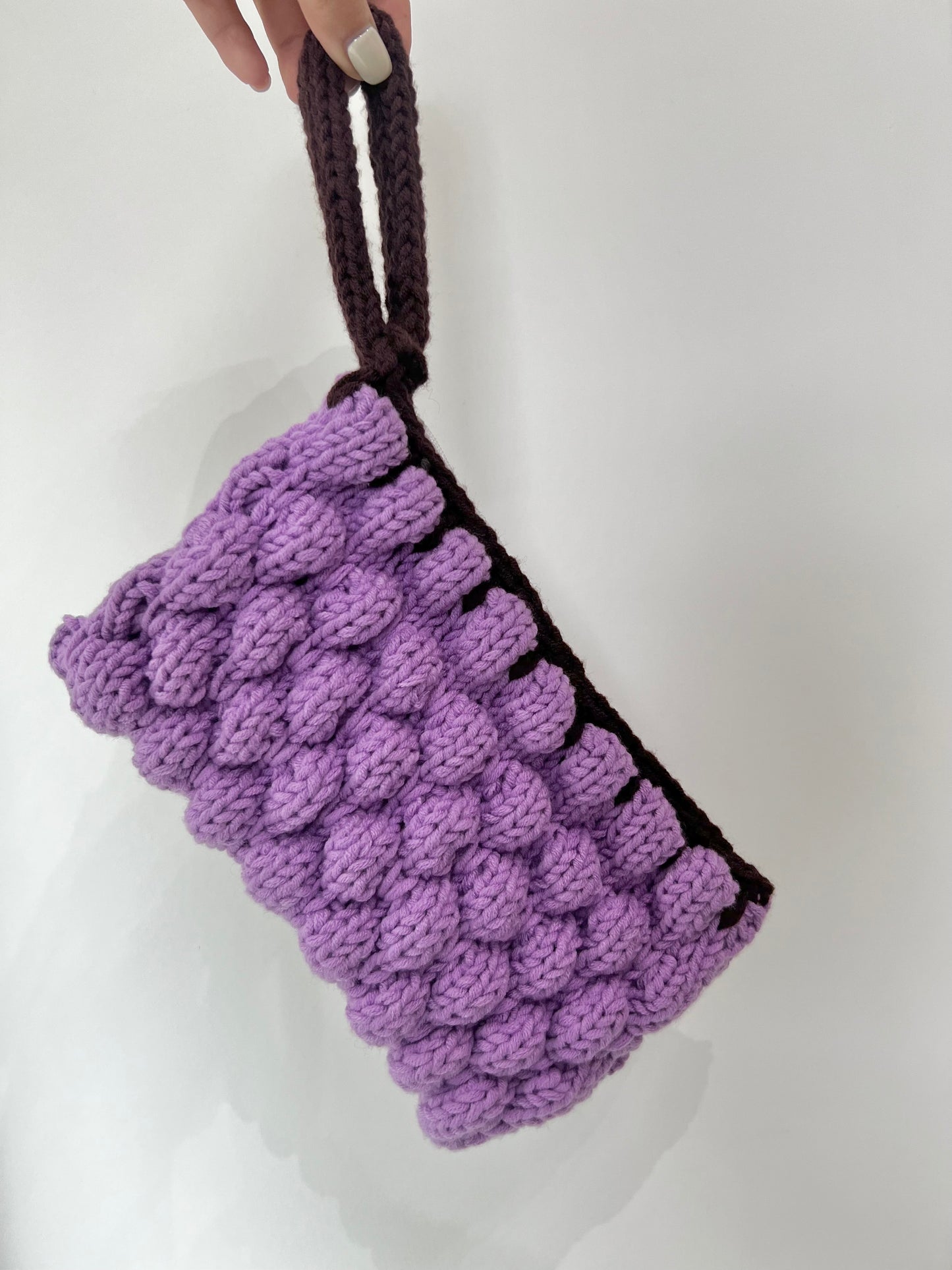 Mom’s purple wrist bag