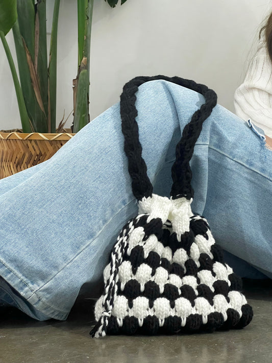 Mom’s black and white big handbag